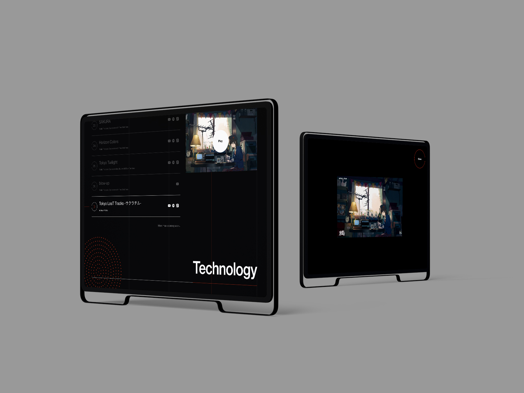 楽曲の一覧と再生画面を表示した2台のタブレット